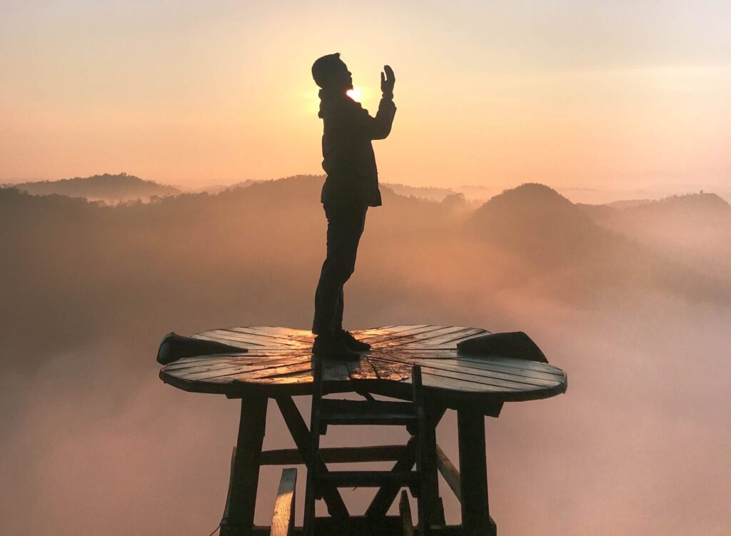 Prayer not working? person praying alone on a stand