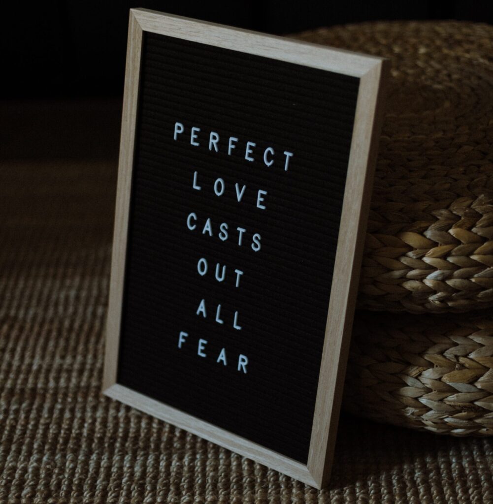 Perfect love casts out all fear on sign